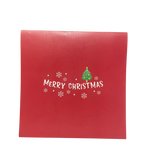 Red gift box with 'Merry Christmas' text and tree design on a white background